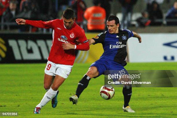 Piotr Trochowski of HSV and Etey Shechter of tel Aviv battle for the ball during their Group C UEFA Europa League match on December 17, 2009 in Tel...