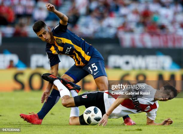 Ignacio Fernandez of River Plate fights for the ball with Joaquin Pereyra of Rosario Central during a match between River Plate and Rosario Central...