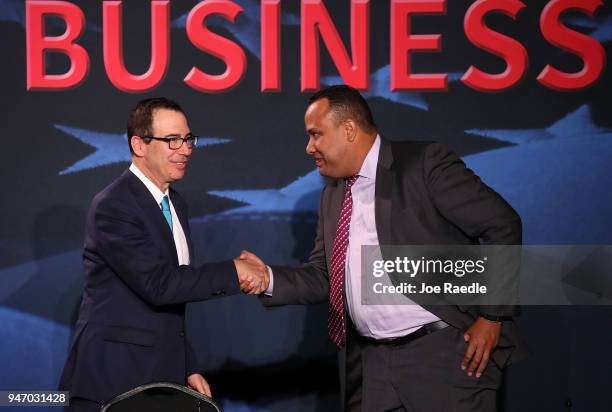 Treasury Secretary Steven Mnuchin greets Jose Mallea before a roundtable discussion with President Donald Trump about the Republican $1.5 trillion...