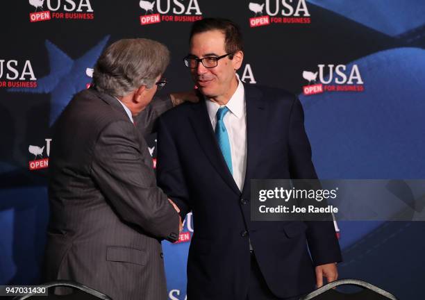 Treasury Secretary Steven Mnuchin greets Maximo Alvarez before a roundtable discussion with President Donald Trump about the Republican $1.5 trillion...