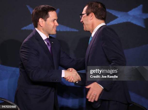 Sen. Marco Rubio greets Treasury Secretary Steven Mnuchin before a roundtable discussion with President Donald Trump about the Republican $1.5...