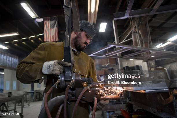 Worker spot welds a metal door during production at the Metal Manufacturing Co. Facility in Sacramento, California, U.S., on Thursday, April 12,...