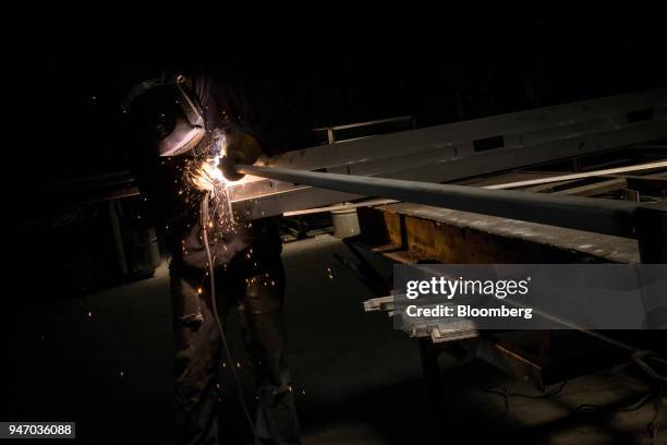 Worker arc welds a door during production at the Metal Manufacturing Co. Facility in Sacramento, California, U.S., on Thursday, April 12, 2018. The...