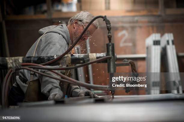 Worker spot welds braces to a door at the Metal Manufacturing Co. Facility in Sacramento, California, U.S., on Thursday, April 12, 2018. The Federal...