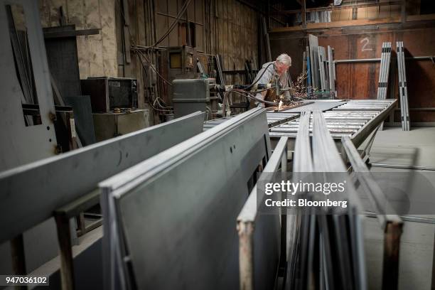 Worker spot welds a brace to a door at the Metal Manufacturing Co. Facility in Sacramento, California, U.S., on Thursday, April 12, 2018. The Federal...