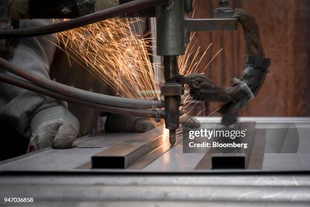 Worker spot welds braces to a door at the Metal Manufacturing Co. Facility in Sacramento, California, U.S., on Thursday, April 12, 2018. The Federal...