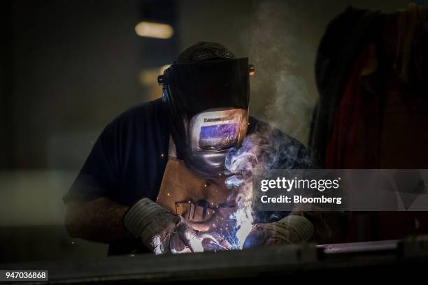 Worker operates a metal inert gas welder to join seams at the Metal Manufacturing Co. Facility in Sacramento, California, U.S., on Thursday, April...
