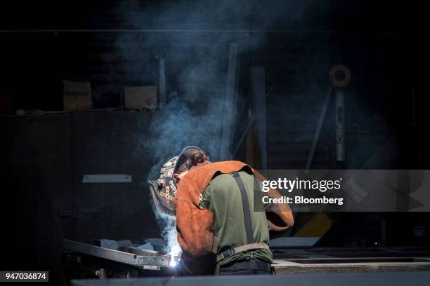 Worker arc welds a metal door during production at the Metal Manufacturing Co. Facility in Sacramento, California, U.S., on Thursday, April 12, 2018....