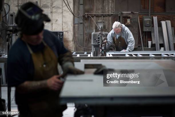 Workers construct doors at the Metal Manufacturing Co. Facility in Sacramento, California, U.S., on Thursday, April 12, 2018. The Federal Reserve is...
