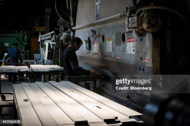 Worker operates a press brake to bend metal at the Metal Manufacturing Co. Facility in Sacramento, California, U.S., on Thursday, April 12, 2018. The...