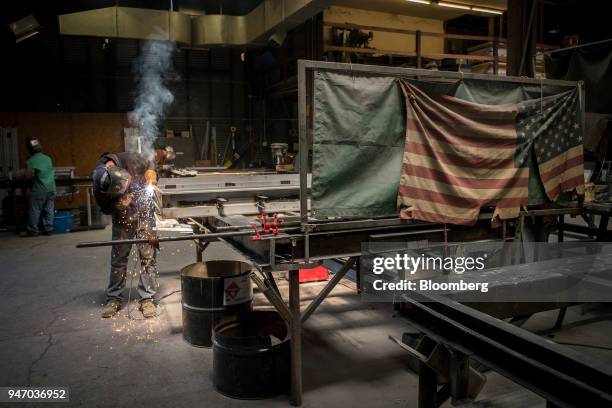 Worker arc welds seams on a metal door at the Metal Manufacturing Co. Facility in Sacramento, California, U.S., on Thursday, April 12, 2018. The...