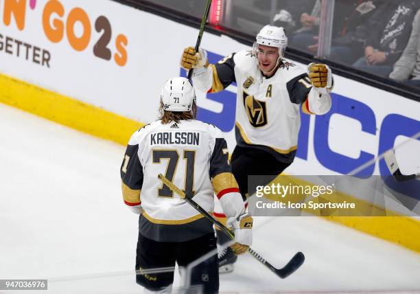 Vegas Golden Knights right wing Reilly Smith celebrates with Vegas Golden Knights center William Karlsson after Karlsson scores a goal against the...