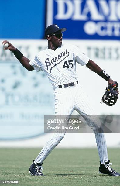 Michael Jordan of the Birmingham Barons throws during an August 1994 game against the Memphis Chicks at Hoover Metropolitan Stadium in Hoover,...