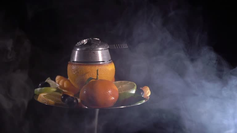 https://media.gettyimages.com/id/947045736/video/hookah-with-ornage-bowl-and-fruits.jpg?b=1&s=640x640&k=20&c=ww_Kr4uuWou7fFB6GPEsqeUaXndTZZsw9ZxBgROPdQc=