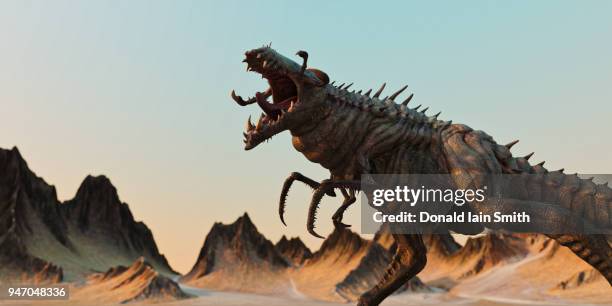 scary alien monster snarling on another planet - scary monster stock pictures, royalty-free photos & images