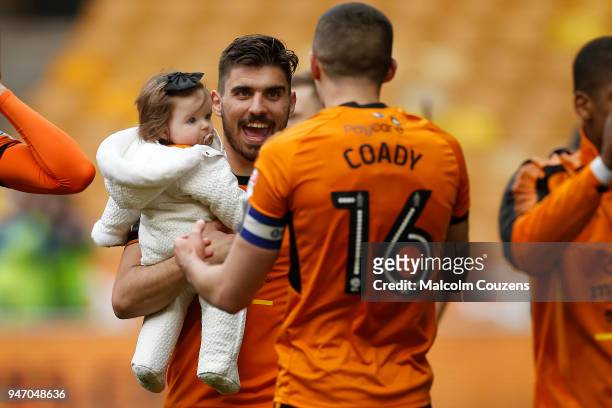 Ruben Neves carries his daughter Margarida during the Sky Bet Championship match between Wolverhampton Wanderers and Birmingham City at Molineux on...