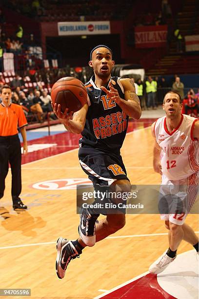 David Logan, #12 of Asseco Prokom puts a jump over Mason Rocca, #12 of Armani Jeans Milano during the Euroleague Basketball Regular Season 2009-2010...