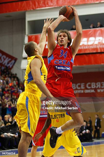 Zoran Planinic, #34 of CSKA Moscow competes with Raviv Limonad, #5 of Maccabi Electra Tel Aviv in action during the Euroleague Basketball Regular...