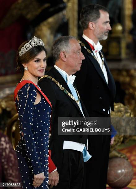 King Felipe VI of Spain and his wife Queen Letizia flank Portuguese President Marcelo Rebelo de Sousa as they receive guests before holding a state...