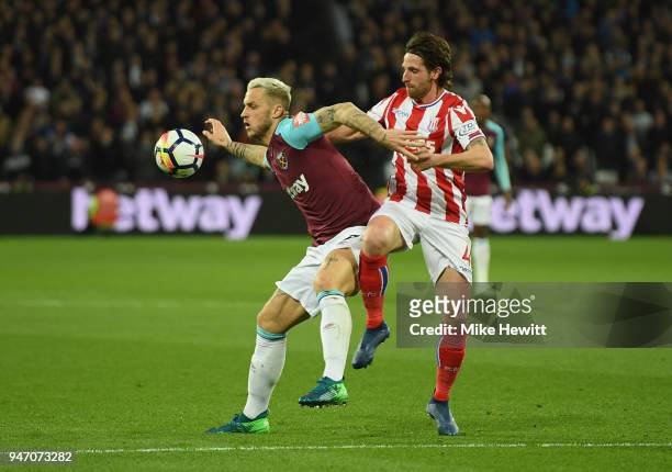 Marko Arnautovic of West Ham United and Joe Allen of Stoke City battle for possession during the Premier League match between West Ham United and...