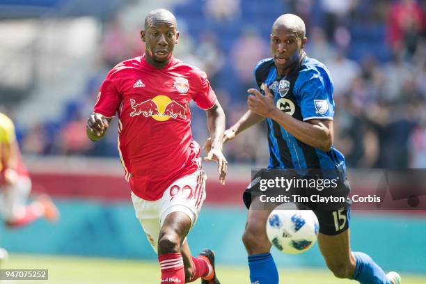 Bradley Wright-Phillips of New York Red Bulls challenged by Rod Fanni of Montreal Impact during the New York Red Bulls Vs Montreal Impact MLS regular...