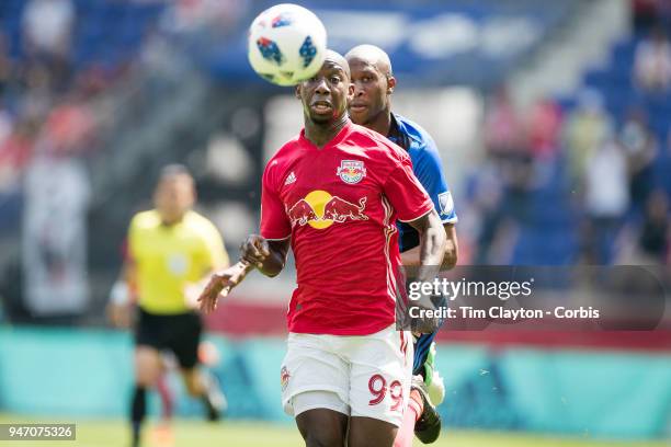 Bradley Wright-Phillips of New York Red Bulls challenged by Rod Fanni of Montreal Impact during the New York Red Bulls Vs Montreal Impact MLS regular...