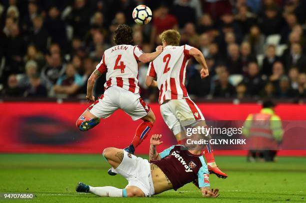 West Ham United's Austrian midfielder Marko Arnautovic vies with Stoke City's Austrian defender Moritz Bauer ) and Stoke City's Welsh midfielder Joe...