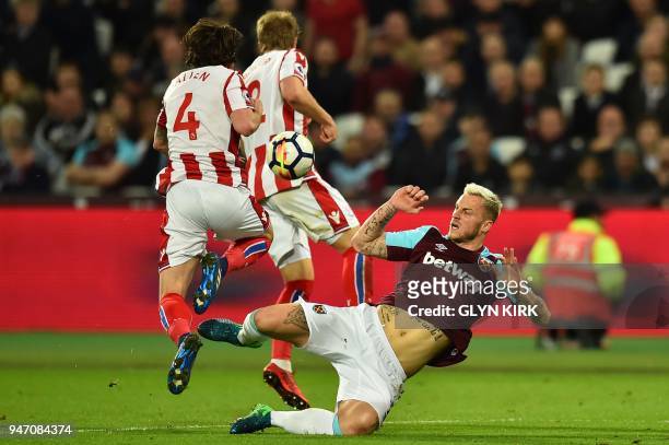 West Ham United's Austrian midfielder Marko Arnautovic vies with Stoke City's Austrian defender Moritz Bauer and Stoke City's Welsh midfielder Joe...