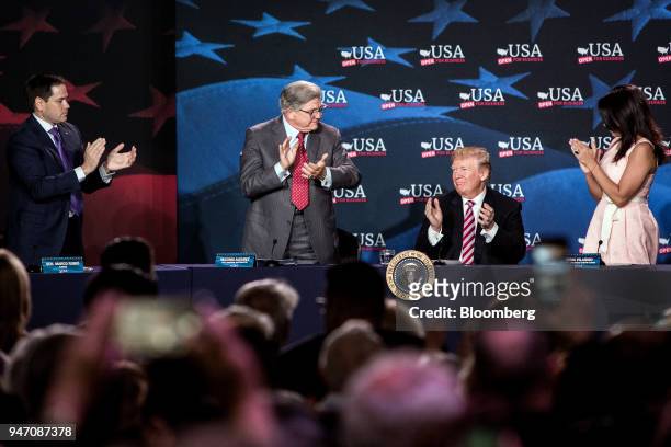 President Donald Trump, second right, applauds with Senator Marco Rubio, a Republican from Florida, from left, Maximo Alvarez, president of Sunshine...