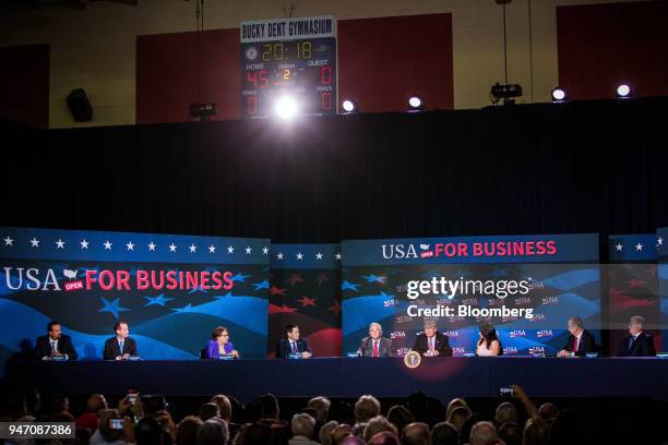 President Donald Trump, fourth right, speaks during roundtable discussion on tax cuts for Florida small businesses in Hialeah, Florida, U.S., on...