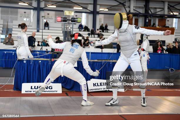 Tiffany Luong of NYU competes against Elyssa Kleiner of Notre Dame in the foil competition during the Division I Women's Fencing Championship held at...