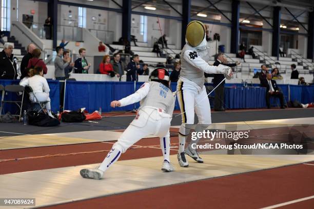 Tiffany Luong of NYU competes against Elyssa Kleiner of Notre Dame in the foil competition during the Division I Women's Fencing Championship held at...