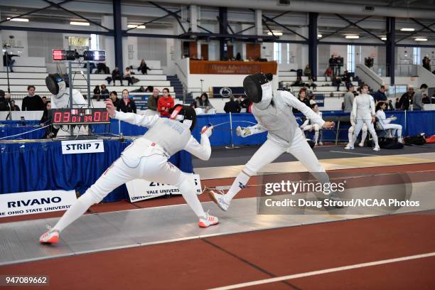 Camilla Rivano of Ohio State University and Anna Zhou of Yale University compete in the foil competition during the Division I Women's Fencing...