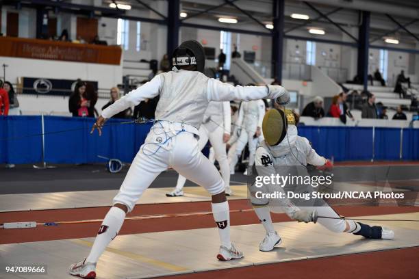 MacKenzie Lawrence of Harvard University and Sabrina Massialas of Notre Dame compete in the foil competition during the Division I Women's Fencing...