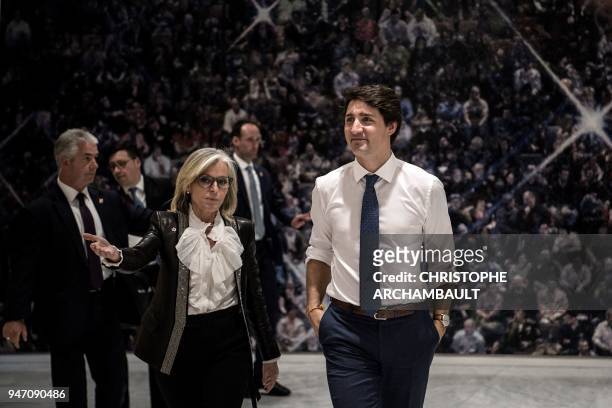 Canadian Prime Minister Justin Trudeau walks with Canadian Ambassador to France Isabelle Hudon as he arrives to attend the inauguration of the new...
