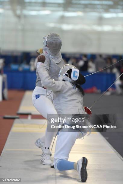 Kerry Plunkett, of Temple University and Violet Michel, of Columbia University, compete in Women's Saber during the Division I Women's Fencing...