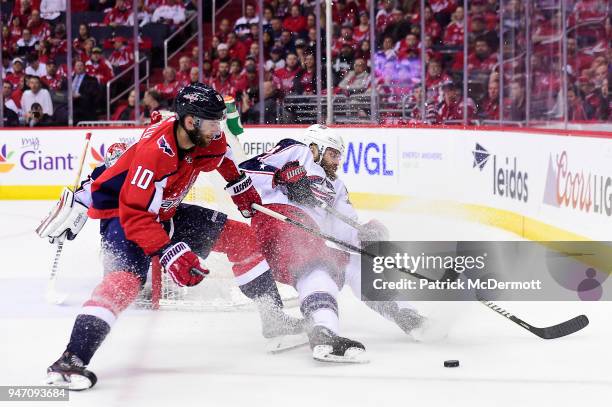 Brett Connolly of the Washington Capitals and Ian Cole of the Columbus Blue Jackets battle for the puck in the first period in Game Two of the...