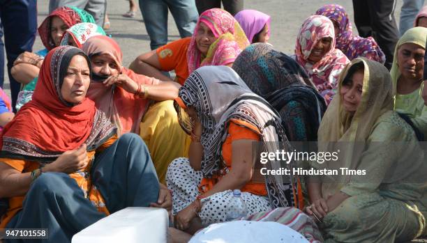 Photo of family members of gangster Bhupesh alias Bhupi Rana who was shot dead by unidentified assailants on Monday morning at Barwala on April 16,...