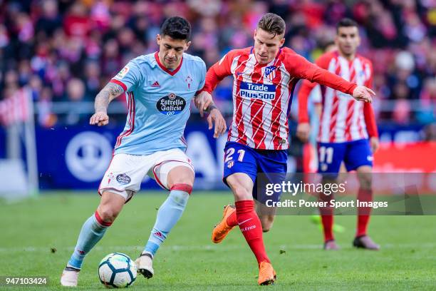 Pedro Pablo Hernandez of RC Celta de Vigo fights for the ball with Kevin Gameiro of Atletico de Madrid during the La Liga 2017-18 match between...