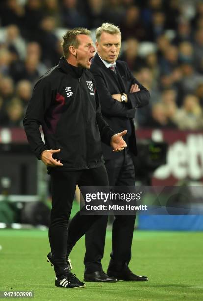 Stuart Pearce, Assistant Manager of West Ham United and David Moyes, Manager of West Ham United reacts during the Premier League match between West...