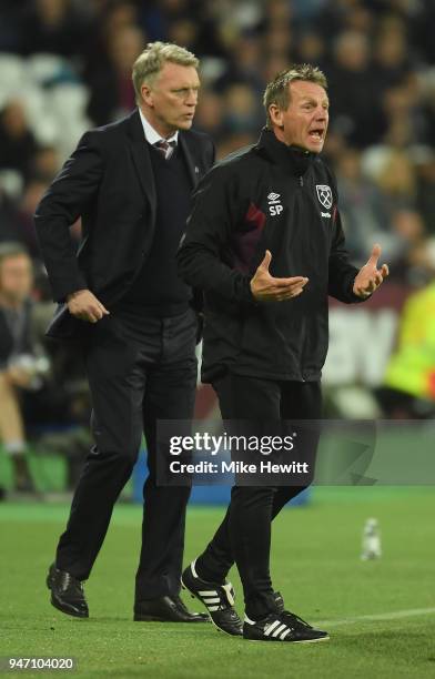 Stuart Pearce, Assistant Manager of West Ham United and David Moyes, Manager of West Ham United reacts during the Premier League match between West...