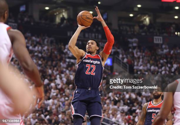 Otto Porter Jr. #22 of the Washington Wizards shoots against the Toronto Raptors in the first quarter during Game One of the first round of the 2018...