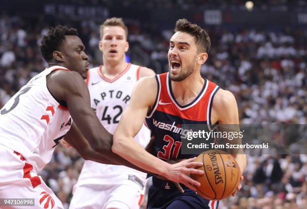 Tomas Satoransky of the Washington Wizards goes to the basket against Pascal Siakam of the Toronto Raptors in the first quarter during Game One of...