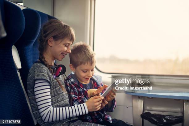 Brother Train Ride Boy In Railway Carriage Photos and Premium High Res Pictures - Getty Images