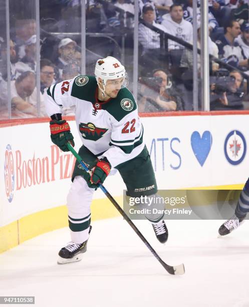 Nino Niederreiter of the Minnesota Wild follows the play around the boards during first period action against the Winnipeg Jets in Game One of the...