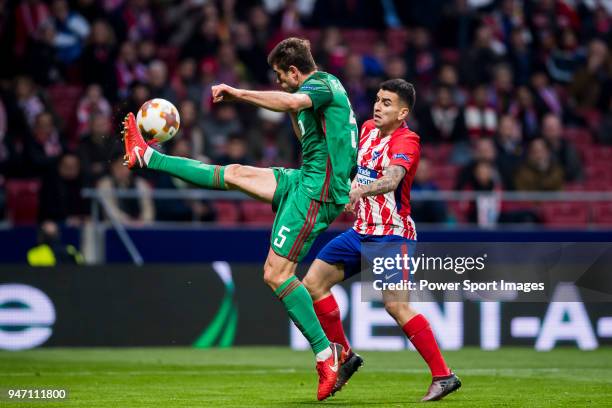 Nemanja Pejcinovic of FC Lokomotiv Moscow fights for the ball with Angel Correa of Atletico de Madrid during the UEFA Europa League 2017-18 Round of...