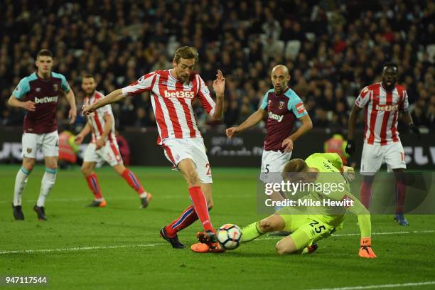 Peter Crouch of Stoke City scores his sides first goal during the Premier League match between West Ham United and Stoke City at London Stadium on...