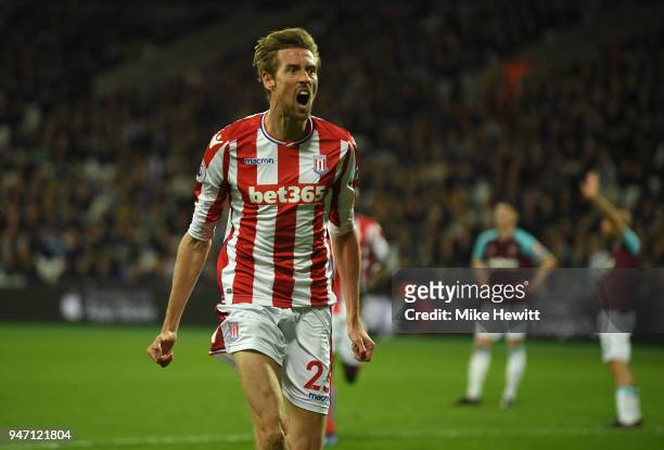 Peter Crouch of Stoke City celebrates scoring his sides first goal during the Premier League match between West Ham United and Stoke City at London...