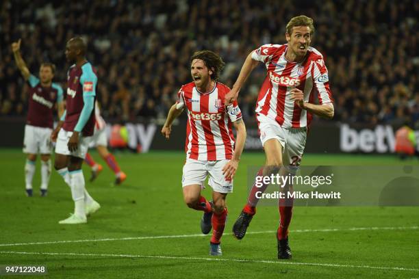 Peter Crouch of Stoke City celebrates with team mate Joe Allen of Stoke City after scoring his sides first goal during the Premier League match...