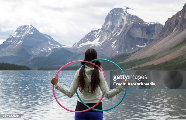 native american woman dances with hoops, in mountains - indigenous culture stock pictures, royalty-free photos & images